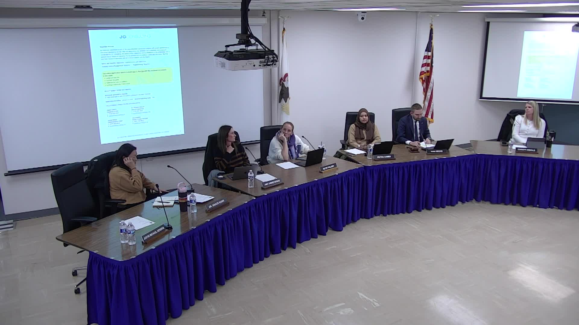 Board Members at front table. 