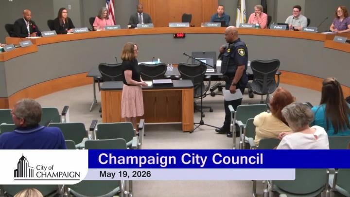 Mayor and Police Chief in front of Council Dais beginning to deliver police officer oaths. 